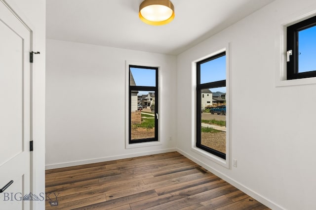 2939 S 30th Ave, Bozeman, MT 59718 - empty room with dark wood-style flooring and baseboards