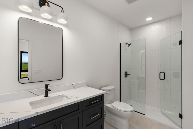 2939 S 30th Ave, Bozeman, MT 59718 - full bathroom featuring vanity, toilet, and a shower stall