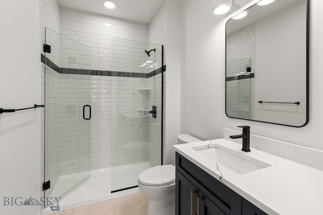 2939 S 30th Ave, Bozeman, MT 59718 - full bath featuring toilet, vanity, a stall shower, and recessed lighting