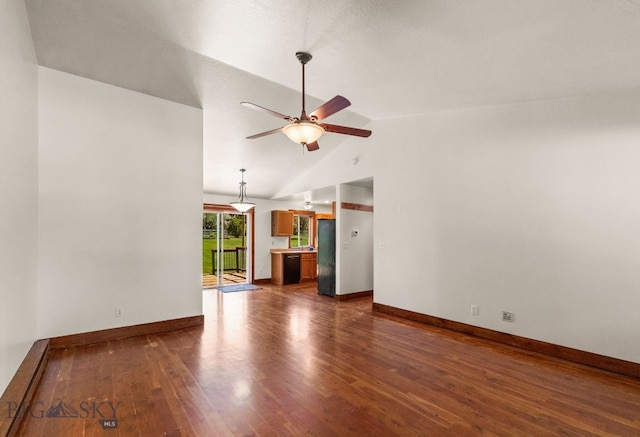 370 Prospector, Bozeman, MT 59718 - unfurnished living room with a ceiling fan, lofted ceiling, dark wood-style floors, and baseboards