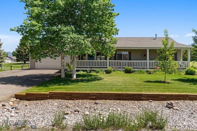 370 Prospector, Bozeman, MT 59718 - view of front of house with asphalt driveway, a front lawn, a porch, and roof with shingles