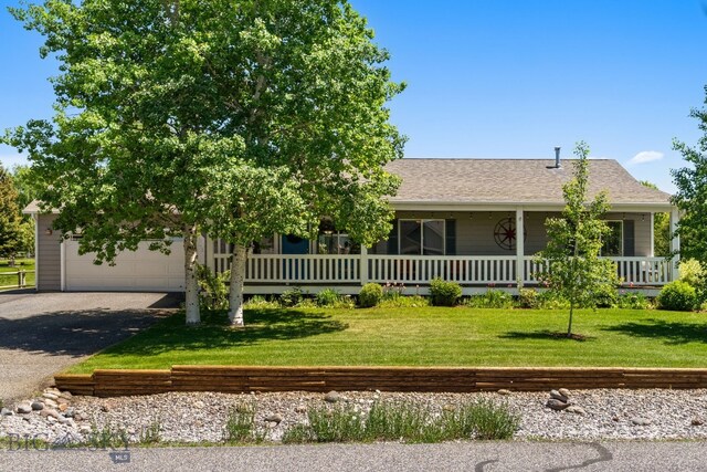 370 Prospector, Bozeman, MT 59718 - view of front facade with driveway, a front lawn, an attached garage, a porch, and a shingled roof