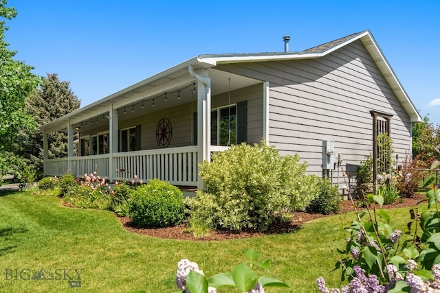 370 Prospector, Bozeman, MT 59718 - view of side of property with a yard and covered porch