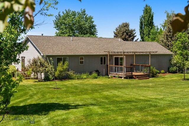370 Prospector, Bozeman, MT 59718 - rear view of house featuring a pergola, a wooden deck, a yard, and roof with shingles