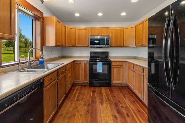 370 Prospector, Bozeman, MT 59718 - kitchen featuring black appliances, a sink, recessed lighting, dark wood-style floors, and light countertops