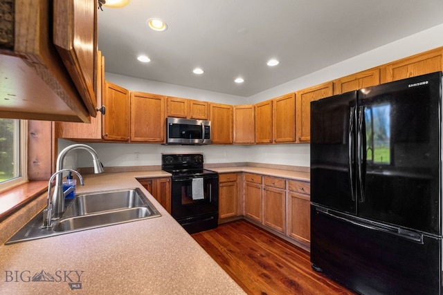 370 Prospector, Bozeman, MT 59718 - kitchen featuring black appliances, a sink, dark wood-style flooring, recessed lighting, and light countertops