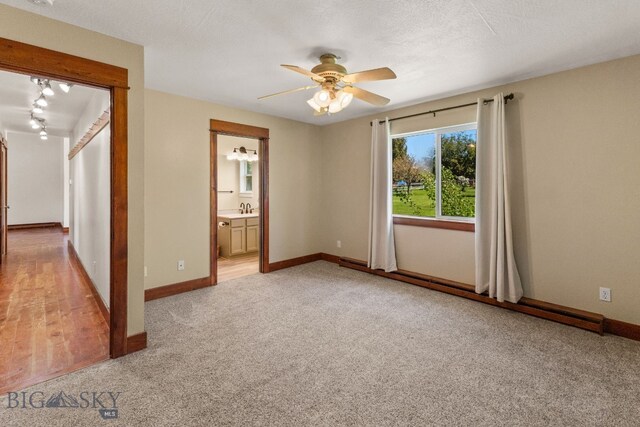 370 Prospector, Bozeman, MT 59718 - spare room with ceiling fan, light colored carpet, a sink, and baseboards
