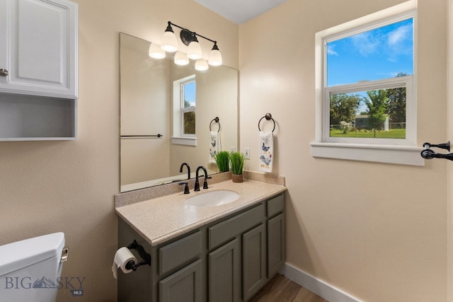 370 Prospector, Bozeman, MT 59718 - half bath featuring vanity, toilet, and baseboards