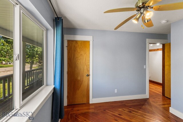 370 Prospector, Bozeman, MT 59718 - unfurnished bedroom with wood finished floors, baseboards, access to outside, and a ceiling fan