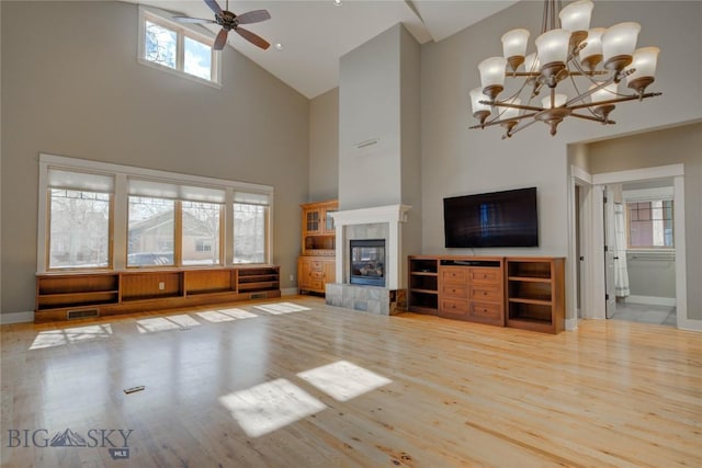 113 Nash Creek Ln, Bozeman, MT 59715 - unfurnished living room featuring high vaulted ceiling, light wood finished floors, baseboards, a ceiling fan, and healthy amount of natural light