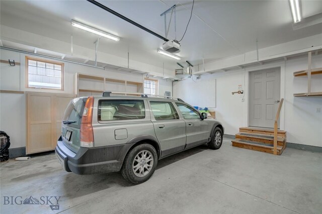 113 Nash Creek Ln, Bozeman, MT 59715 - garage with a garage door opener and baseboards