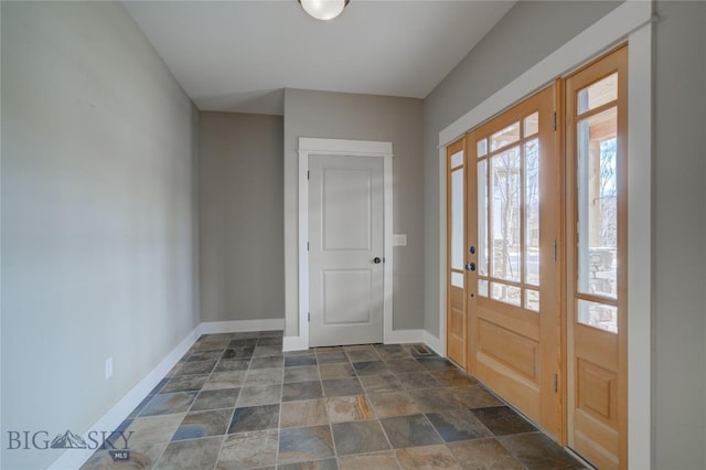 113 Nash Creek Ln, Bozeman, MT 59715 - foyer featuring baseboards and stone finish floors