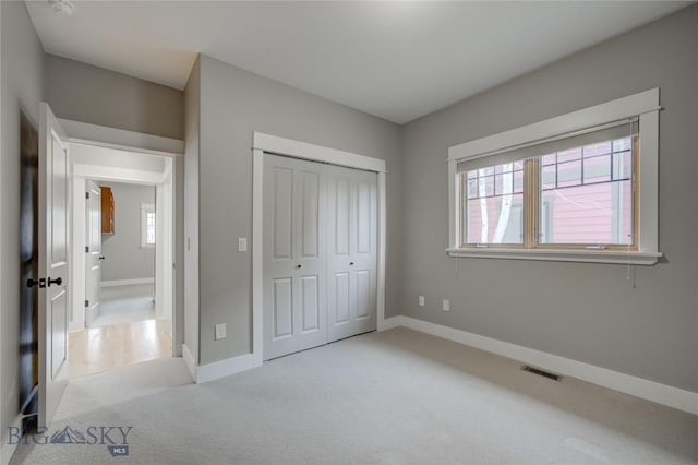 113 Nash Creek Ln, Bozeman, MT 59715 - unfurnished bedroom featuring carpet, baseboards, and a closet