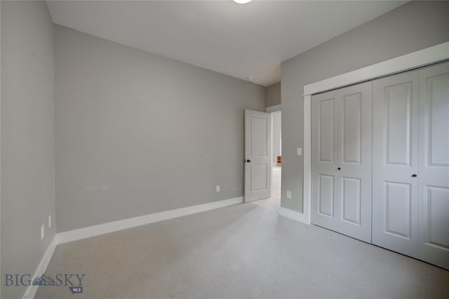 113 Nash Creek Ln, Bozeman, MT 59715 - unfurnished bedroom featuring a closet and baseboards