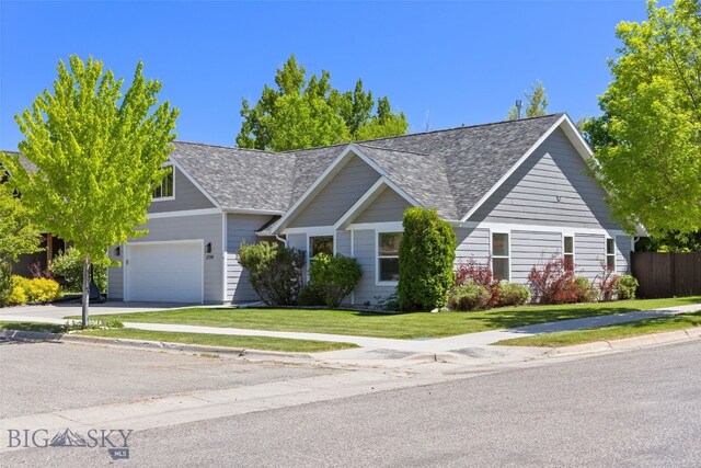 3194 Oliver St, Bozeman, MT 59718 - traditional-style house featuring a shingled roof, an attached garage, a front lawn, and concrete driveway
