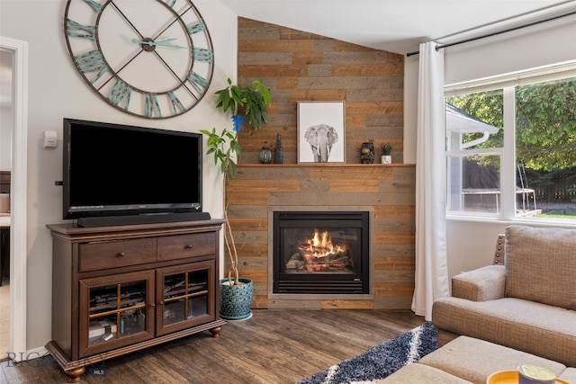 3194 Oliver St, Bozeman, MT 59718 - living room featuring wood finished floors, a fireplace, and vaulted ceiling