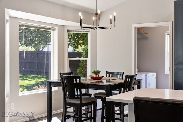 3194 Oliver St, Bozeman, MT 59718 - dining room featuring healthy amount of natural light, a chandelier, and wood finished floors