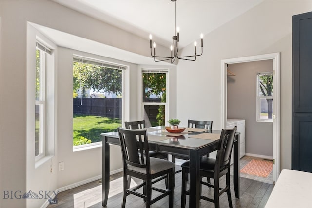 3194 Oliver St, Bozeman, MT 59718 - dining space featuring healthy amount of natural light, a chandelier, and dark wood-type flooring