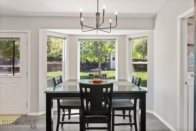 3194 Oliver St, Bozeman, MT 59718 - dining area with a chandelier, wood finished floors, and baseboards
