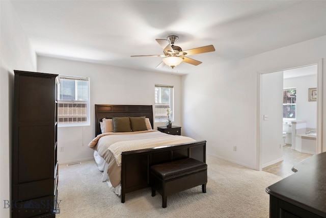 3194 Oliver St, Bozeman, MT 59718 - bedroom with light carpet, baseboards, ceiling fan, and ensuite bathroom