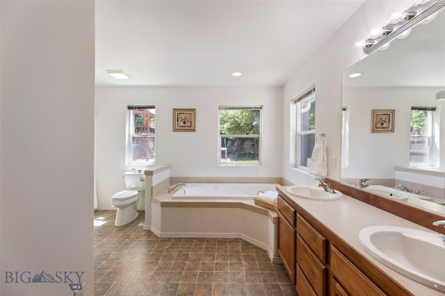 3194 Oliver St, Bozeman, MT 59718 - bathroom with a garden tub, healthy amount of natural light, toilet, and recessed lighting