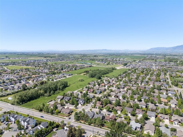 3194 Oliver St, Bozeman, MT 59718 - aerial overview of property's location featuring a mountain backdrop and nearby suburban area