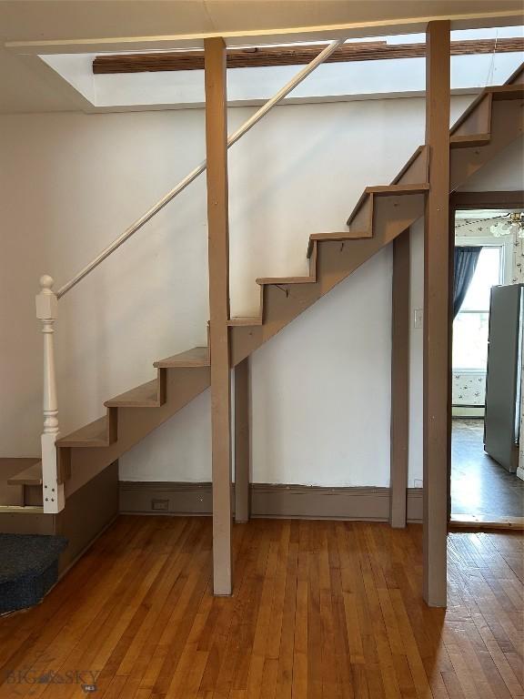1106 Caledonia St, Butte, MT 59701 - basement with hardwood / wood-style floors and stairway