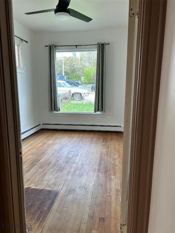 1106 Caledonia St, Butte, MT 59701 - spare room with hardwood / wood-style floors and a ceiling fan