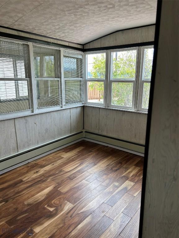 1106 Caledonia St, Butte, MT 59701 - unfurnished sunroom with vaulted ceiling and baseboard heating