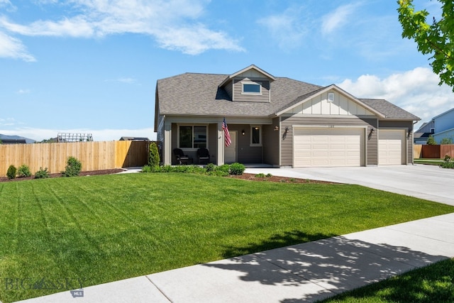 1165 Stewart Loop, Bozeman, MT 59718 - view of front of house with an attached garage, driveway, board and batten siding, and roof with shingles