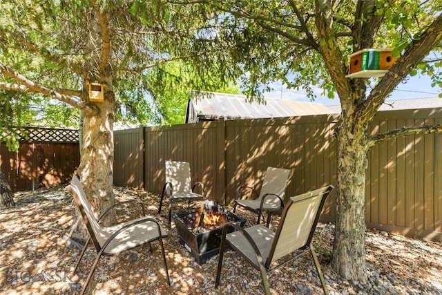 3197 Rose St, Bozeman, MT 59718 - fenced backyard featuring an outdoor fire pit