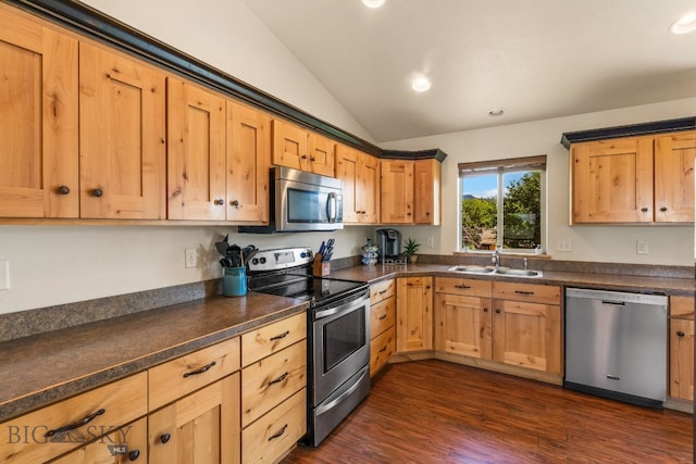 205 Water St, Sheridan, MT 59749 - kitchen with appliances with stainless steel finishes, vaulted ceiling, dark countertops, recessed lighting, and dark wood-style floors