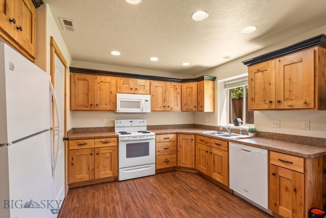 205 Water St, Sheridan, MT 59749 - kitchen with white appliances, dark wood-type flooring, dark countertops, recessed lighting, and a textured ceiling
