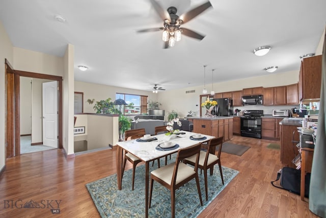 191 Barnes Dr, Belgrade, MT 59714 - dining room with ceiling fan and light wood-type flooring