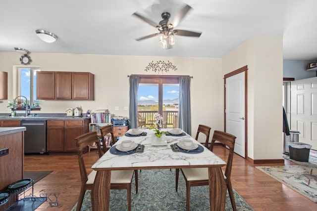 191 Barnes Dr, Belgrade, MT 59714 - dining room with a ceiling fan and dark wood finished floors