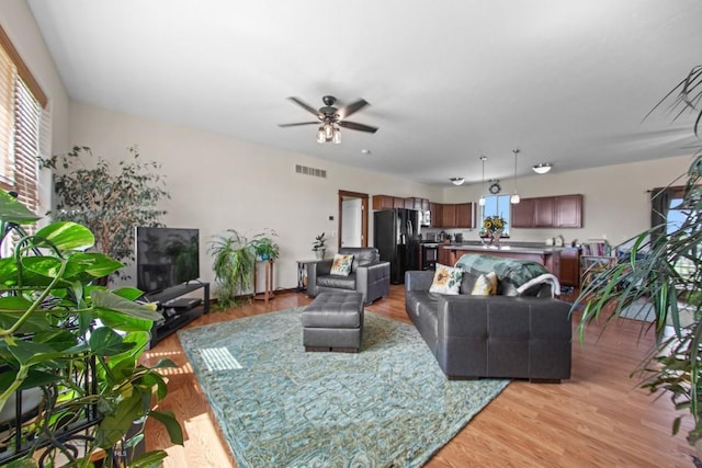 191 Barnes Dr, Belgrade, MT 59714 - living area with a ceiling fan and light wood-style flooring