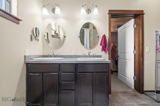 191 Barnes Dr, Belgrade, MT 59714 - bathroom with double vanity and tile patterned floors