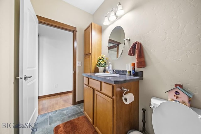 191 Barnes Dr, Belgrade, MT 59714 - bathroom with stone finish floors and vanity