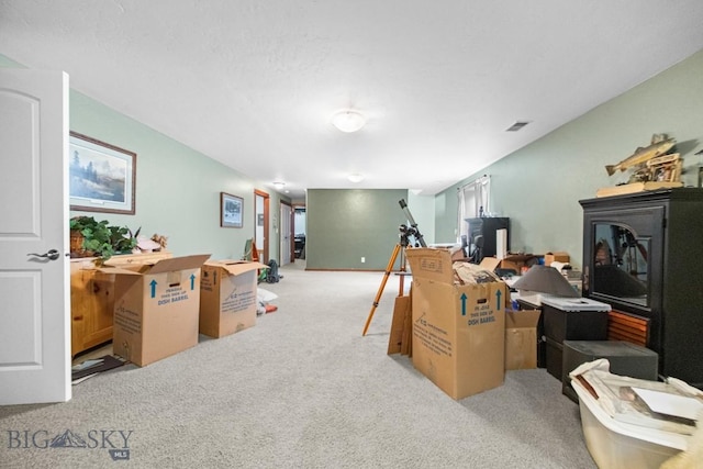 191 Barnes Dr, Belgrade, MT 59714 - carpeted home office featuring a wood stove