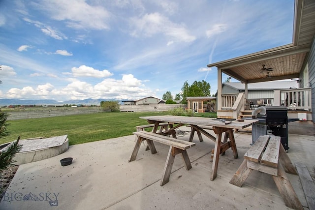 191 Barnes Dr, Belgrade, MT 59714 - view of patio / terrace with outdoor dining space, a ceiling fan, a grill, and an outdoor structure