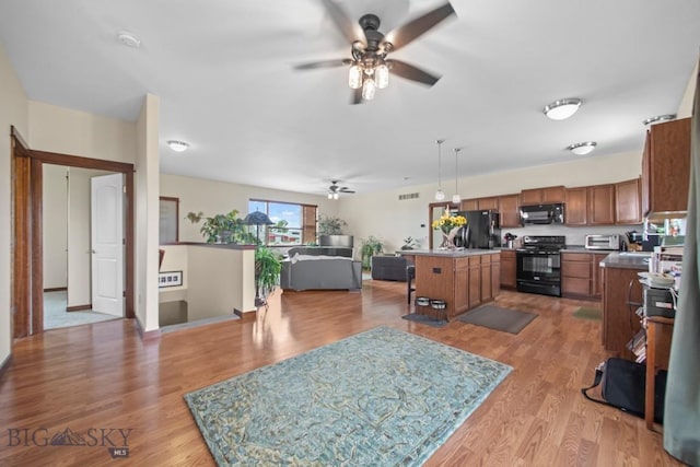 191 Barnes Dr, Belgrade, MT 59714 - living room featuring ceiling fan and light wood finished floors