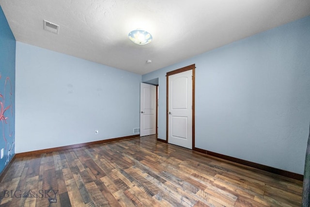 191 Barnes Dr, Belgrade, MT 59714 - empty room with wood finished floors and baseboards