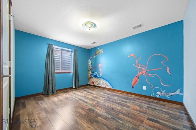 191 Barnes Dr, Belgrade, MT 59714 - spare room featuring wood finished floors and baseboards