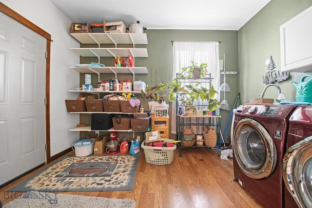 191 Barnes Dr, Belgrade, MT 59714 - laundry area featuring cabinet space, separate washer and dryer, and wood finished floors