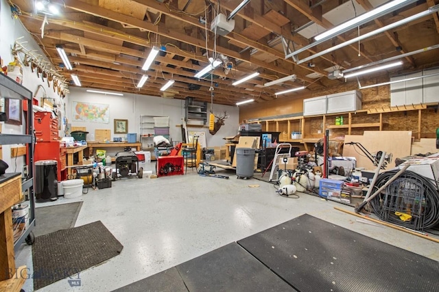 191 Barnes Dr, Belgrade, MT 59714 - garage featuring a workshop area and a garage door opener