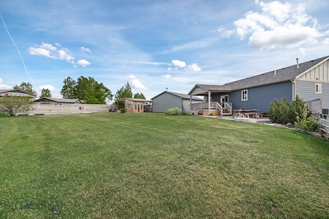 191 Barnes Dr, Belgrade, MT 59714 - view of yard with a deck and an outbuilding