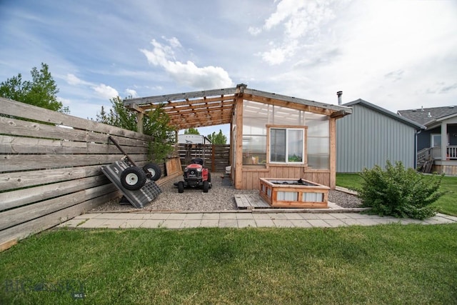 191 Barnes Dr, Belgrade, MT 59714 - view of patio featuring an exterior structure, an outdoor structure, and a pergola