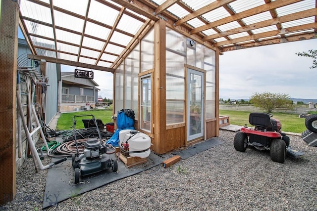 191 Barnes Dr, Belgrade, MT 59714 - view of patio with a greenhouse, an outdoor structure, and a pergola