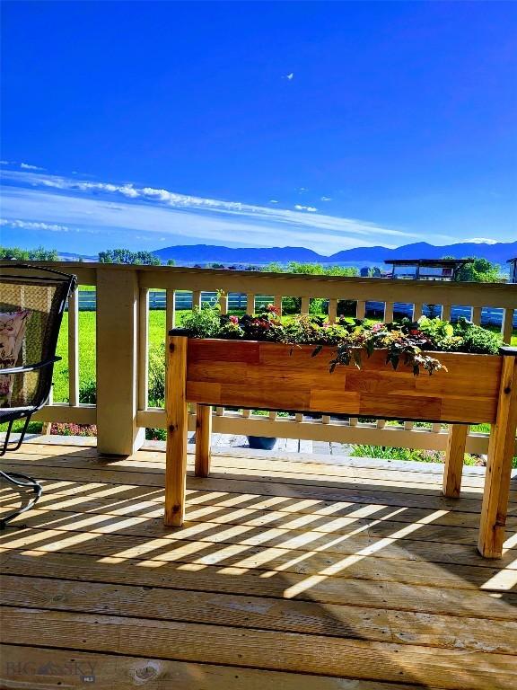 191 Barnes Dr, Belgrade, MT 59714 - wooden deck featuring a mountain view
