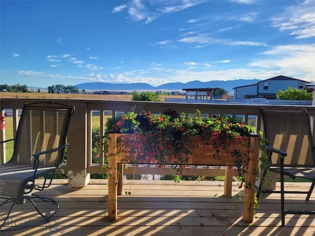 191 Barnes Dr, Belgrade, MT 59714 - wooden deck with a mountain view